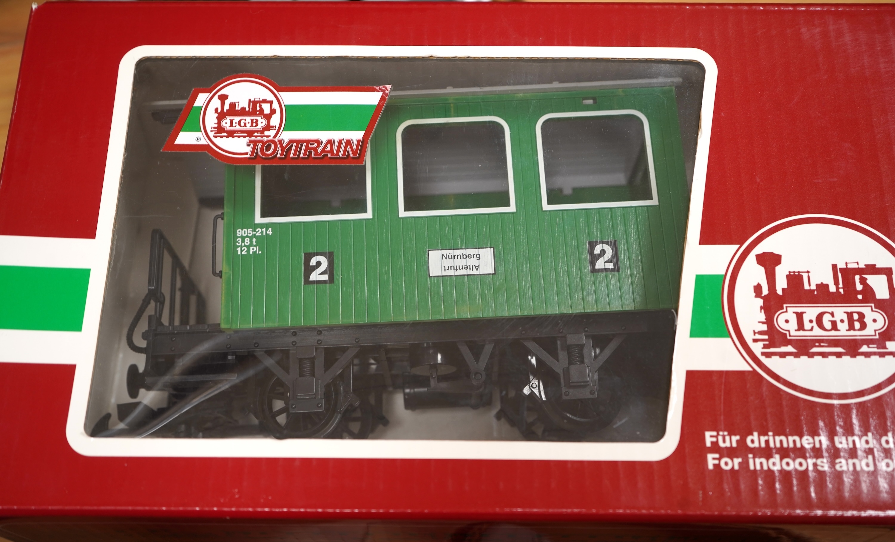 Four Lehmann and Bachmann G scale (45mm gauge) freight wagons; an unconstructed Bachmann Big Haulers G Kits 4-door Baggage Car (98910), an LGB 4-wheel coach in associated box, plus two others by Lehmann Toytrain in assoc